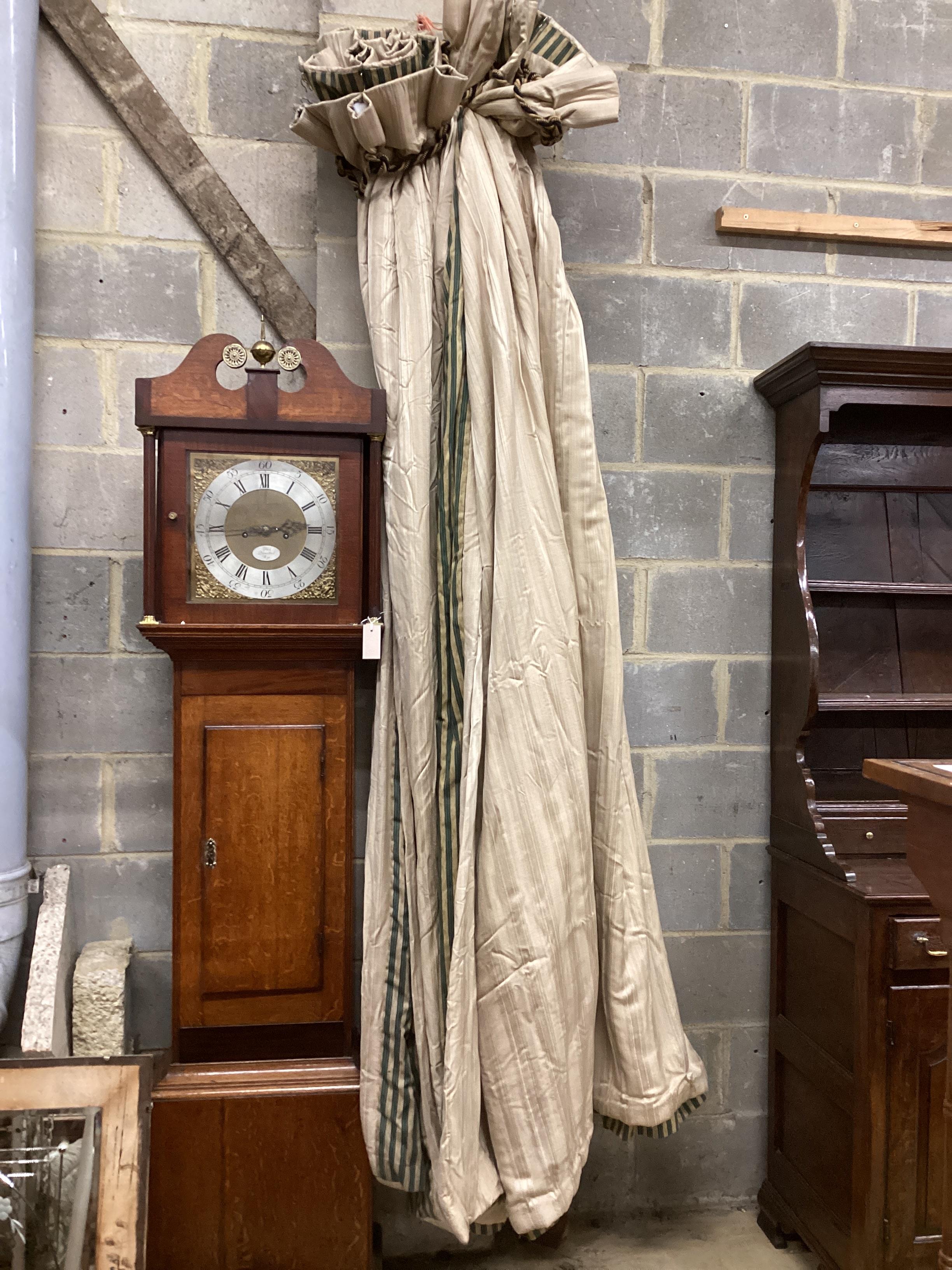 A pair of gold striped curtains with green / gold striped linings, approximate widths 150cm top , 300cm floor, 240cm drop.